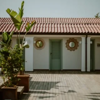 Contemporary house in Panama with unique circular window designs and a green door.