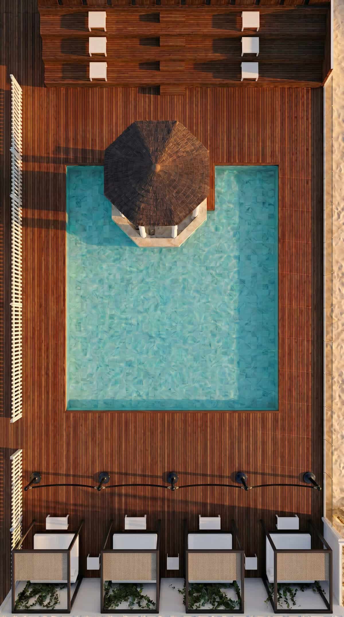 Relaxing pool area with wooden deck, sun loungers, and shaded umbrella at Eclipse Sound, Panama, May.